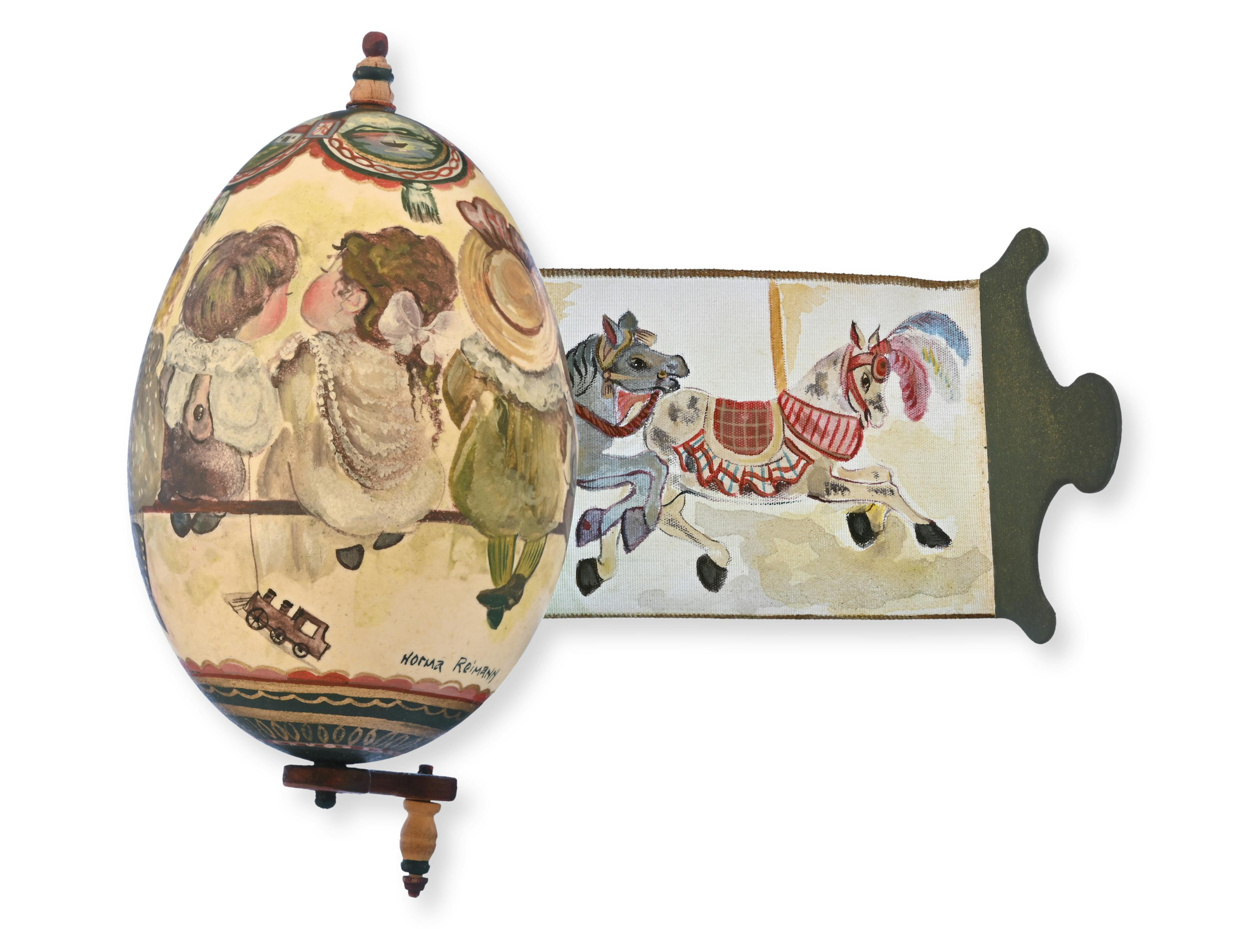 Gänseei, bemalt, mit Kurbel und textilem Spruchband, bemalt, Norma Reimann, Schweiz, 1989