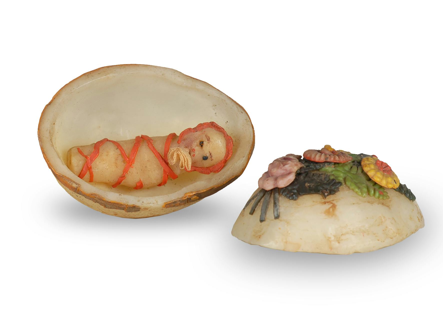 Fatschenkind in Wachsei, 5.7 cm, Herkunft unbekannt, keine Angaben zur Datierung