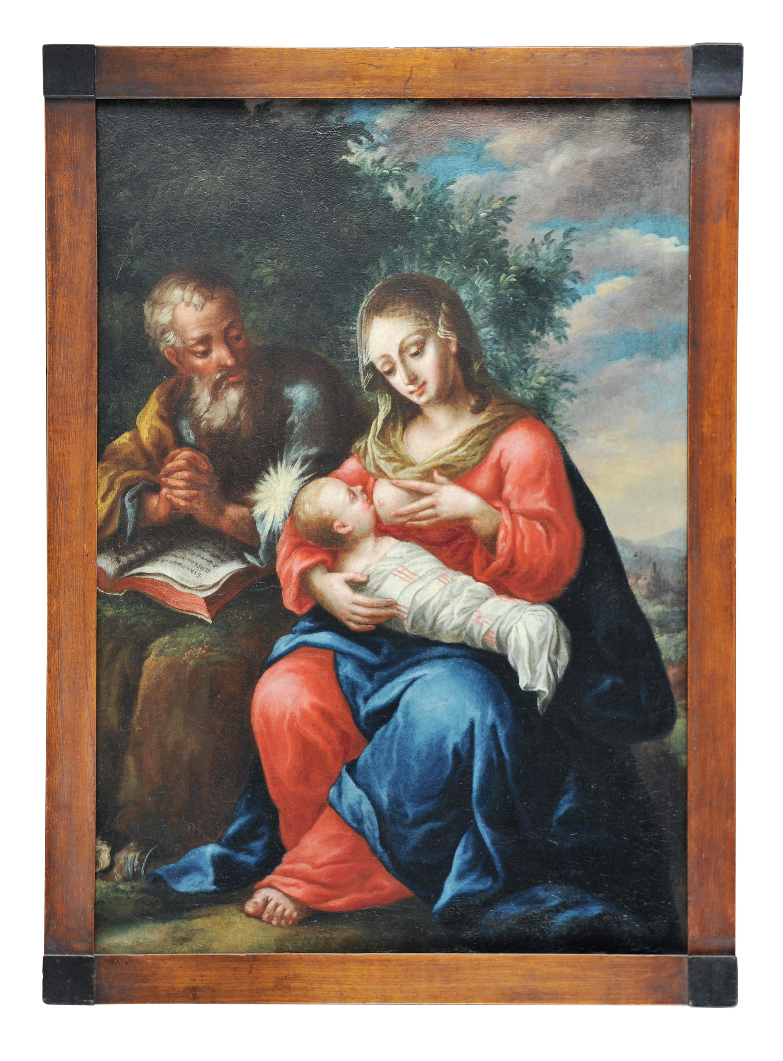 Die heilige Familie in einer Landschaft.